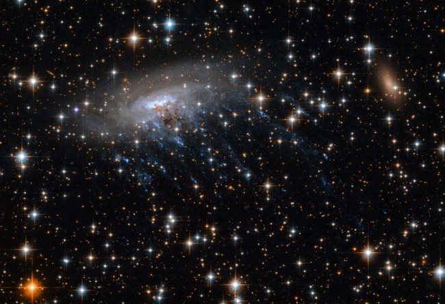 Spiral-Galaxy-Death-Captured-by-Hubble-650x444.jpg