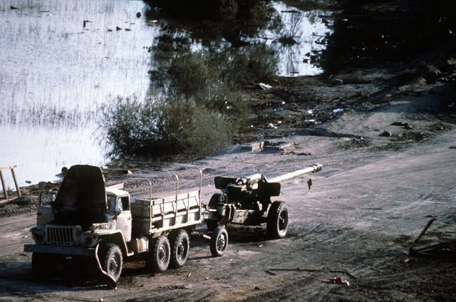 an-iraqi-m-46-130mm-howitzer-behind-a-ur
