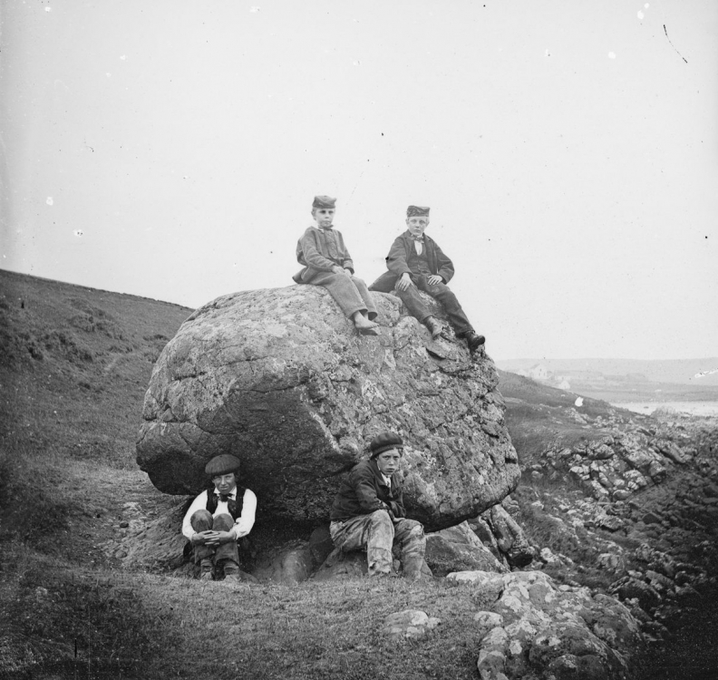 Four-boys-at-the-22Rocking-Stone22-at-Islandmagee-County-Antrim.1870.jpg